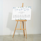 Blue floral wedding order of the day sign - white crisp background, sophisticated black text, with elegant blue florals adorned on the top and bottom edge. The perfect customised wedding signs.