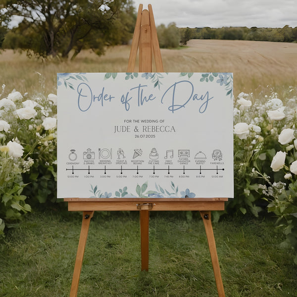 Blue floral wedding order of the day sign - white crisp background, sophisticated black text, with elegant blue florals adorned on the top and bottom edge. The perfect customised wedding signs.