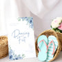 A stylish wedding sign reading "A little treat for your dancing feet, please take a pair", displayed next to a basket of flip-flops for guests. The design features elegant typography, perfect for a wedding reception.