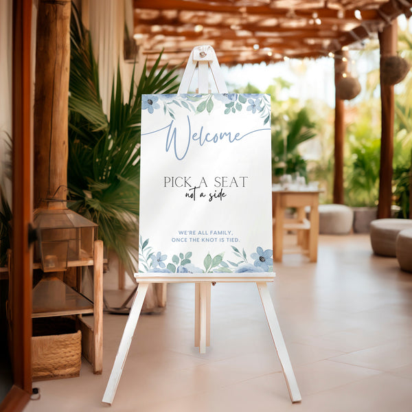 blue floral pick a seat not a side wedding ceremony sign - a personalised "pick  seat, not a side" wedding welcome sign, with a crisp white background and elegant dusty blue text, adorned with soft blue floral blooms