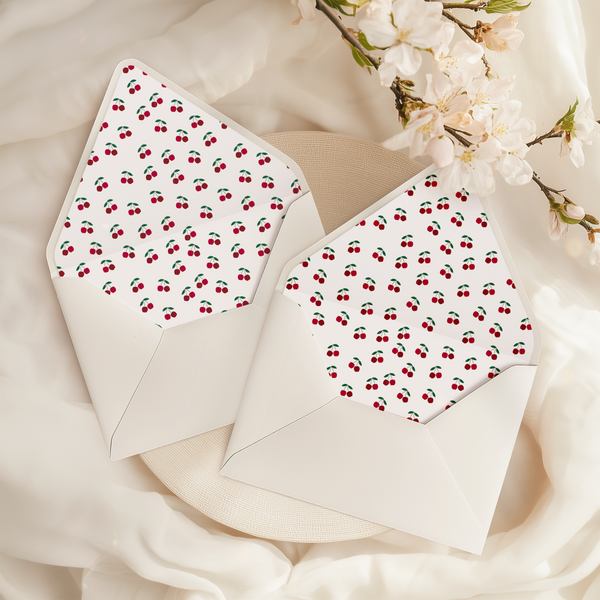 A flat lay of elegant wedding invitation envelopes, partially open to reveal beautifully designed envelope liners in various styles, including floral, modern, and classic patterns. The envelope inserts add a touch of luxury and sophistication to the stationery set.