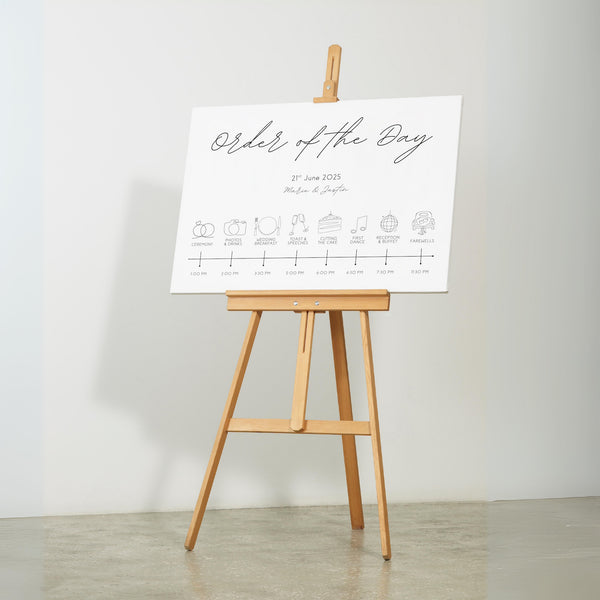 dreamy white order of the day wedding board, with sophisticated and delicate black text, in a calligraphy font