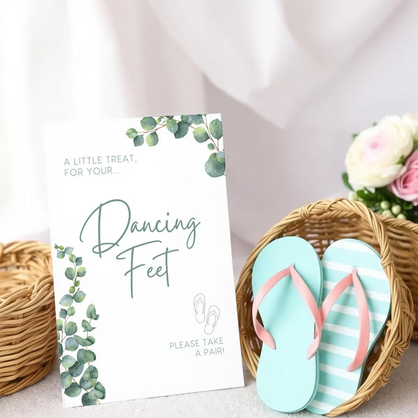 A stylish wedding sign reading "A little treat for your dancing feet, please take a pair", displayed next to a basket of flip-flops for guests. The design features elegant typography, perfect for a wedding reception.