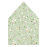 A flat lay of elegant wedding invitation envelopes, partially open to reveal beautifully designed envelope liners in various styles, including floral, modern, and classic patterns. The envelope inserts add a touch of luxury and sophistication to the stationery set.
