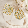 A flat lay of elegant wedding invitation envelopes, partially open to reveal beautifully designed envelope liners in various styles, including floral, modern, and classic patterns. The envelope inserts add a touch of luxury and sophistication to the stationery set.