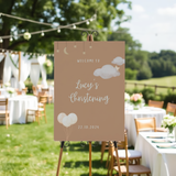 Personalised Christening Welcome Sign – A beautifully designed welcome sign featuring the baby’s name and event details, displayed on an easel at a christening venue.