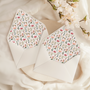 A flat lay of elegant wedding invitation envelopes, partially open to reveal beautifully designed envelope liners in various styles, including floral, modern, and classic patterns. The envelope inserts add a touch of luxury and sophistication to the stationery set.