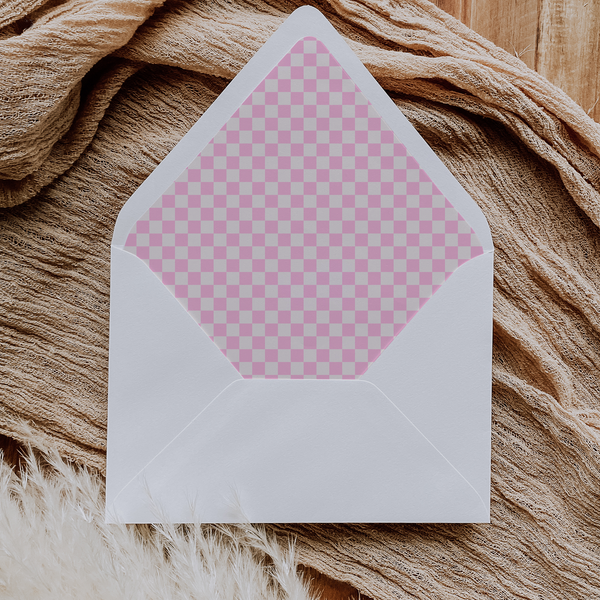 A flat lay of elegant wedding invitation envelopes, partially open to reveal beautifully designed envelope liners in various styles, including floral, modern, and classic patterns. The envelope inserts add a touch of luxury and sophistication to the stationery set.