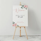 Pink Roses floral Pick a Seat Not a Side wedding ceremony sign - personalised wedding ceremony welcome sign, with a crisp white background, elegant blush pink typography, and adorned with sophisticated pink roses