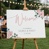 Pink Rose Floral wedding welcome sign in landscape orientation. A beautiful wedding welcome board, personalised with names and a date, adorned with pink roses and soft blush hues.