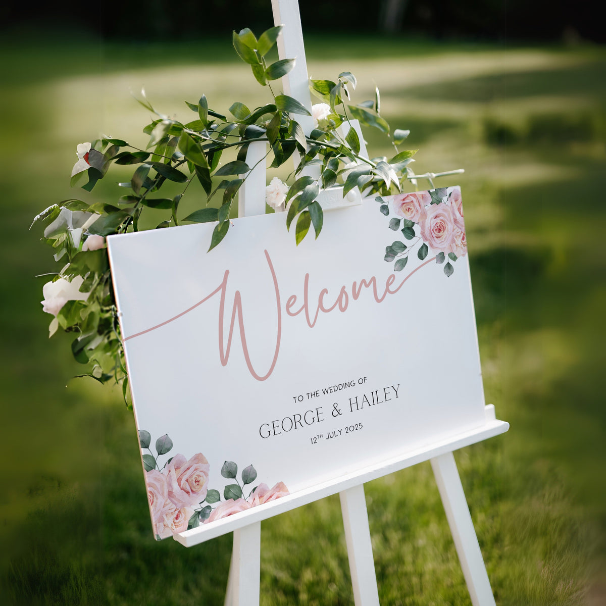 Pink Rose Floral wedding welcome sign in landscape orientation. A beautiful wedding welcome board, personalised with names and a date, adorned with pink roses and soft blush hues.