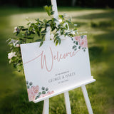 Pink Rose Floral wedding welcome sign in landscape orientation. A beautiful wedding welcome board, personalised with names and a date, adorned with pink roses and soft blush hues.