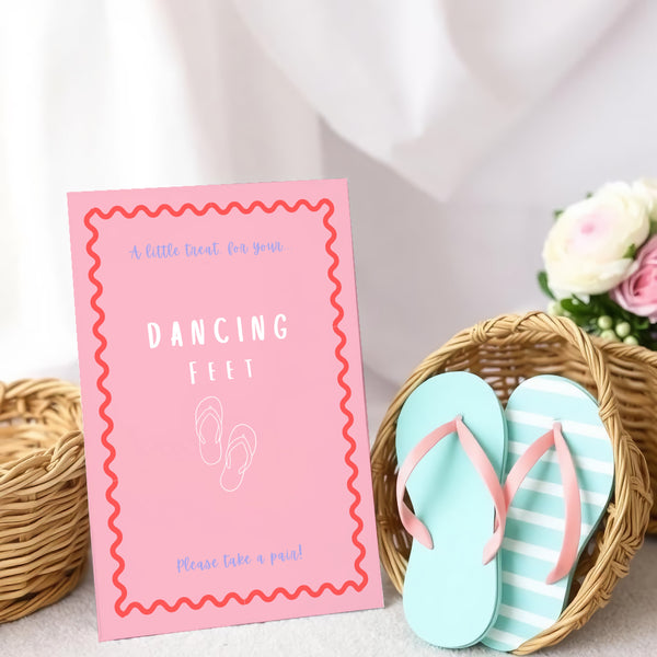 A stylish wedding sign reading "A little treat for your dancing feet, please take a pair", displayed next to a basket of flip-flops for guests. The design features elegant typography, perfect for a wedding reception.