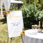 Sunflowers floral pick a seat not a side wedding ceremony sign - personalised pick a seat sign, with a crisp white background and an elegant yet joyful yellow typography, adorned with rustic and vibrant sunflowers.