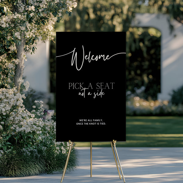 timeless black pick a seat not a side wedding welcome sign - personalised chic black wedding ceremony sign, featuring a bold black background, with elegant white typography, giving the ultimate classy-chic look.