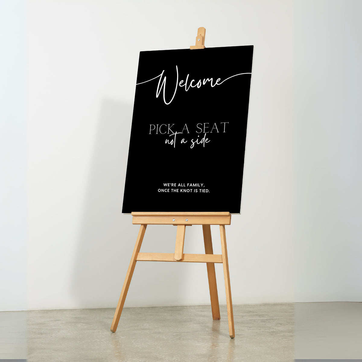 timeless black pick a seat not a side wedding welcome sign - personalised chic black wedding ceremony sign, featuring a bold black background, with elegant white typography, giving the ultimate classy-chic look.