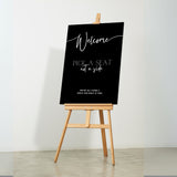 timeless black pick a seat not a side wedding welcome sign - personalised chic black wedding ceremony sign, featuring a bold black background, with elegant white typography, giving the ultimate classy-chic look.