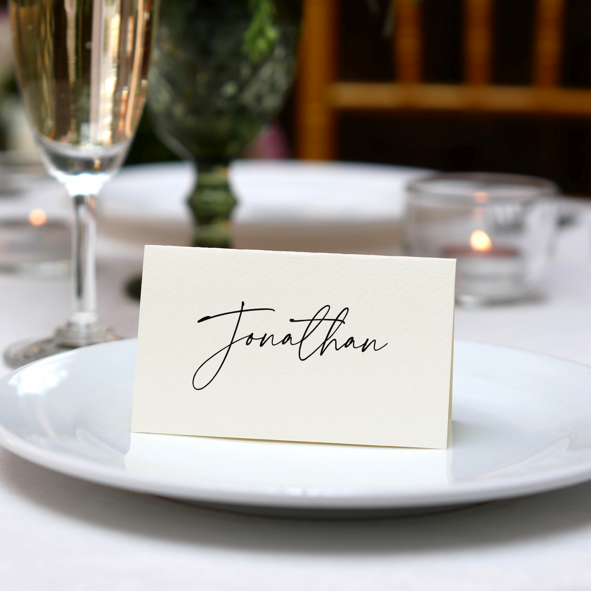 Personalised Wedding Place Cards – Elegant, custom wedding place cards with guest names, featuring a discreet QR code on the reverse for photo sharing.