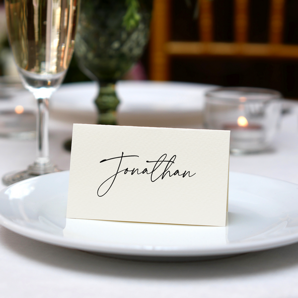 Personalised Wedding Place Cards – Elegant, custom wedding place cards with guest names, featuring a discreet QR code on the reverse for photo sharing.