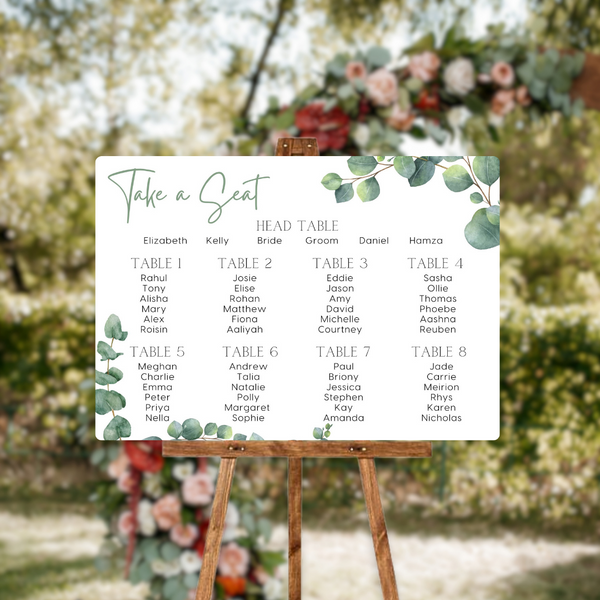 wedding seating plan sign featuring eucalyptus foliage