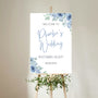 blue floral bride's wedding featuring groom sign - funny wedding welcome sign