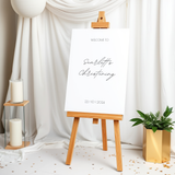 Personalised Christening Welcome Sign – A beautifully designed welcome sign featuring the baby’s name and event details, displayed on an easel at a christening venue.