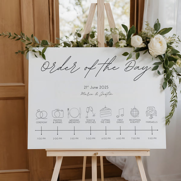 dreamy white order of the day wedding board, with sophisticated and delicate black text, in a calligraphy font