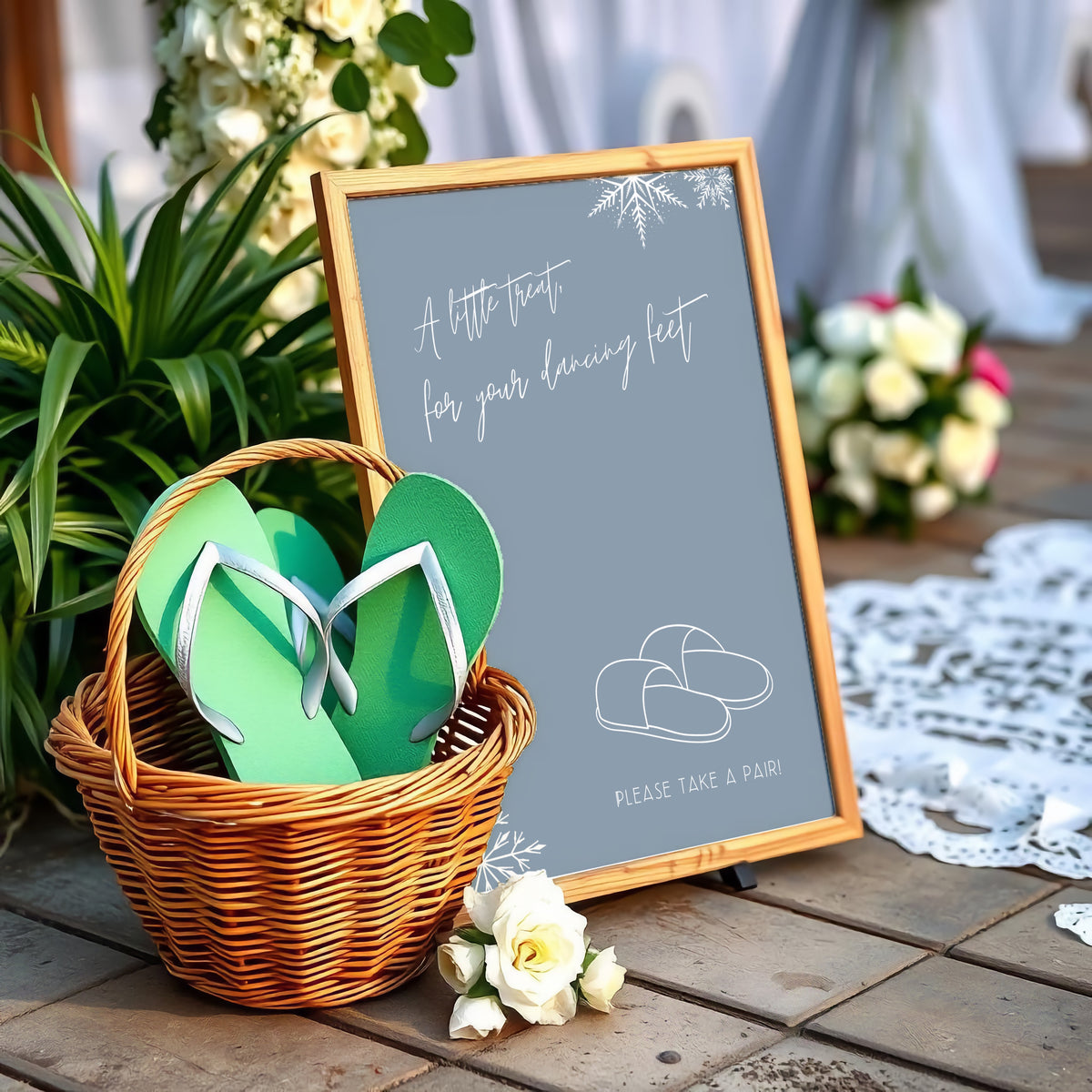 A stylish wedding sign reading "A little treat for your dancing feet, please take a pair", displayed next to a basket of flip-flops for guests. The design features elegant typography, perfect for a wedding reception.