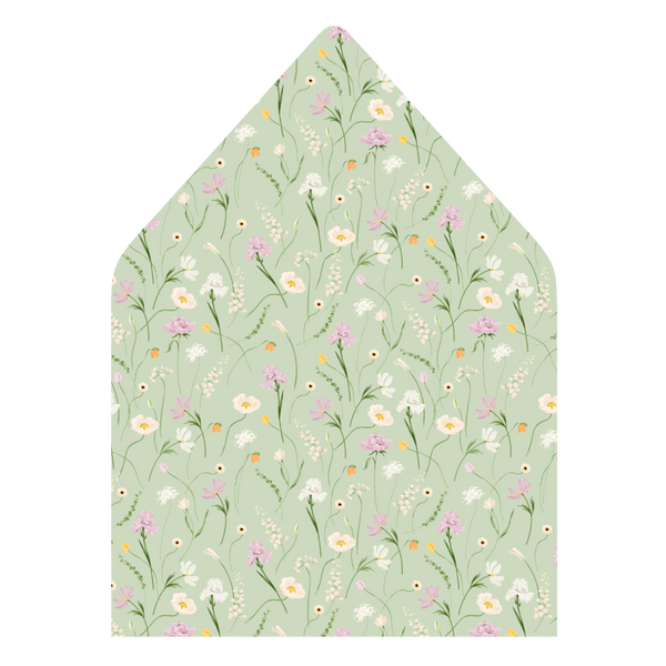 A flat lay of elegant wedding invitation envelopes, partially open to reveal beautifully designed envelope liners in various styles, including floral, modern, and classic patterns. The envelope inserts add a touch of luxury and sophistication to the stationery set.