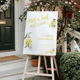 Limoncello pick a seat not a side wedding sign with lemon watercolour illustrations and yellow script text