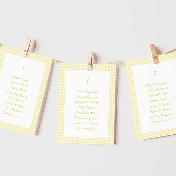 Limoncello wedding seating plan cards with lemon watercolour illustrations and yellow script text