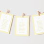 Limoncello wedding seating plan cards with lemon watercolour illustrations and yellow script text