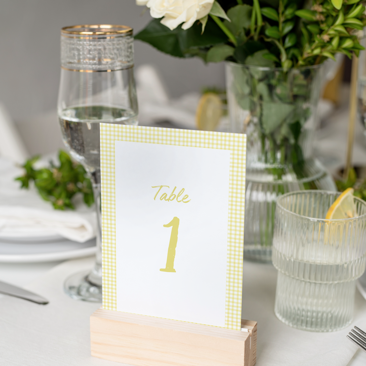 Limoncello wedding table number card with lemon watercolour illustrations and yellow script text
