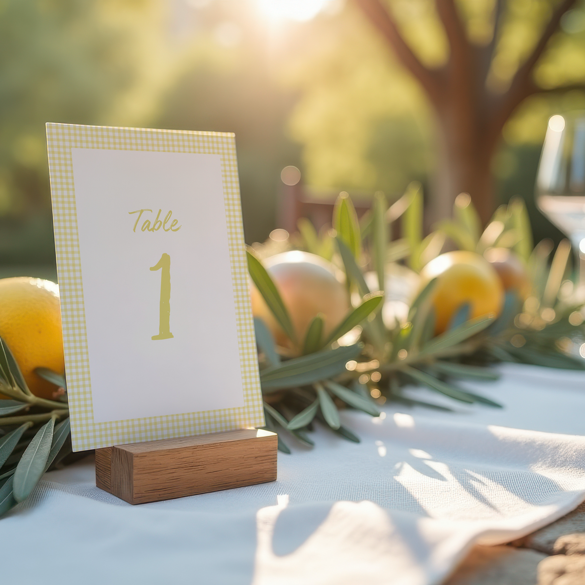 Limoncello wedding table number card with lemon watercolour illustrations and yellow script text