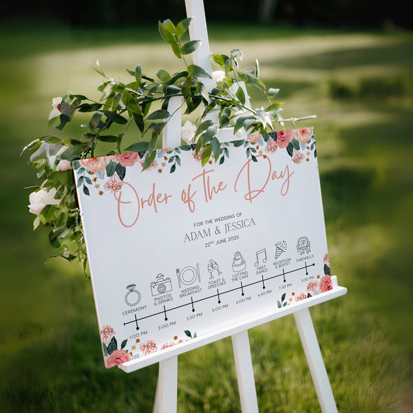 peach and pink floral wedding order of the day board - elegant yet vibrant peach florals, against a crisp white background, with sophisticated black text and icons, to blissfully guide guests throughout the day.