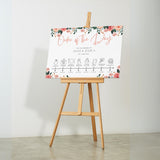 peach and pink floral wedding order of the day board - elegant yet vibrant peach florals, against a crisp white background, with sophisticated black text and icons, to blissfully guide guests throughout the day.