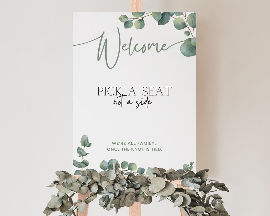 eucalyptus pick a seat not a side wedding ceremony sign - a personalised "pick  seat, not a side" wedding welcome sign, with a crisp white background and elegant green text, adorned with eucalyptus foliage