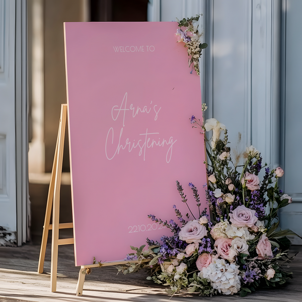 Personalised Christening Welcome Sign – A beautifully designed welcome sign featuring the baby’s name and event details, displayed on an easel at a christening venue.