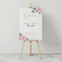 Pink Roses floral Pick a Seat Not a Side wedding ceremony sign - personalised wedding ceremony welcome sign, with a crisp white background, elegant blush pink typography, and adorned with sophisticated pink roses