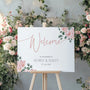 Pink Rose Floral wedding welcome sign in landscape orientation. A beautiful wedding welcome board, personalised with names and a date, adorned with pink roses and soft blush hues.