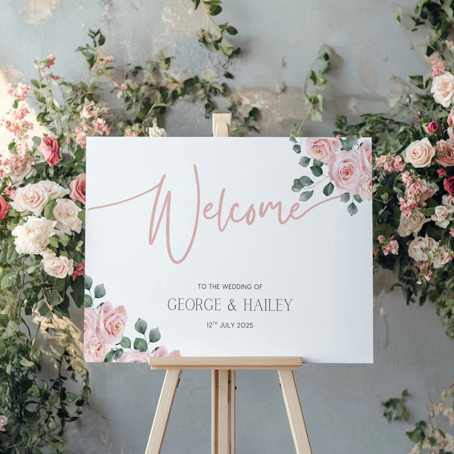 Pink Rose Floral wedding welcome sign in landscape orientation. A beautiful wedding welcome board, personalised with names and a date, adorned with pink roses and soft blush hues.