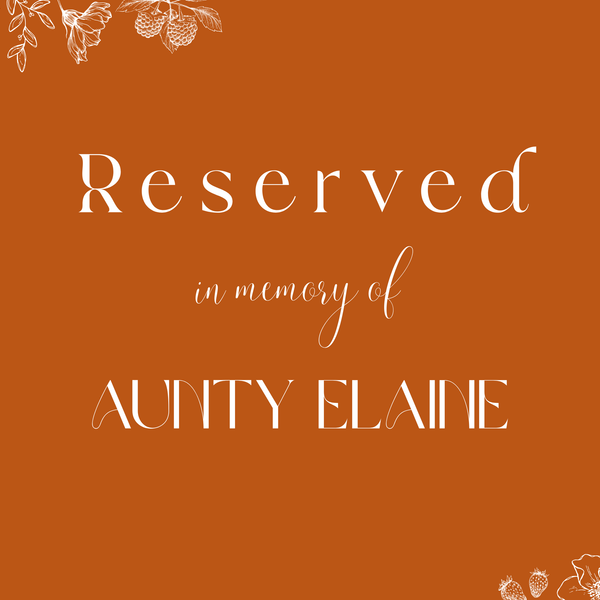Toasted Amber reserved in memory wedding chair sign with burnt orange background and white botanical line art