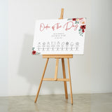 romantic red floral order of the day wedding sign - a crisp white background, with elegant black text and soft, romantic red blooms.