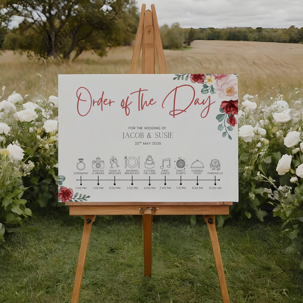 romantic red floral order of the day wedding sign - a crisp white background, with elegant black text and soft, romantic red blooms.