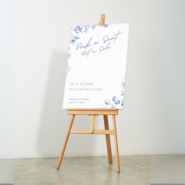 Santorini pick a seat not a side wedding sign with blue botanical sketches and elegant handwritten script