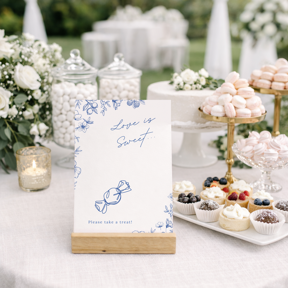 Santorini sweet table wedding sign with blue botanical sketches and elegant handwritten script