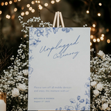 Santorini unplugged ceremony wedding sign with blue botanical sketches and elegant handwritten script