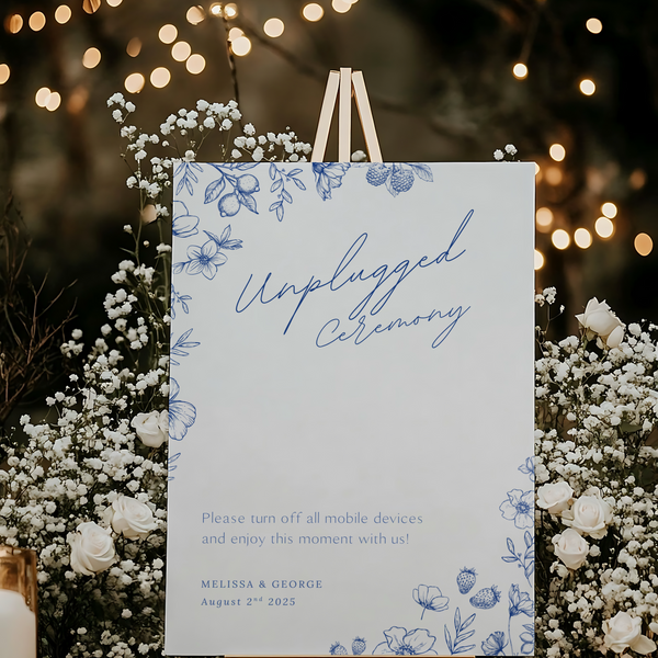 Santorini unplugged ceremony wedding sign with blue botanical sketches and elegant handwritten script