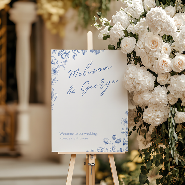 Santorini wedding welcome sign with blue botanical sketches and elegant handwritten script