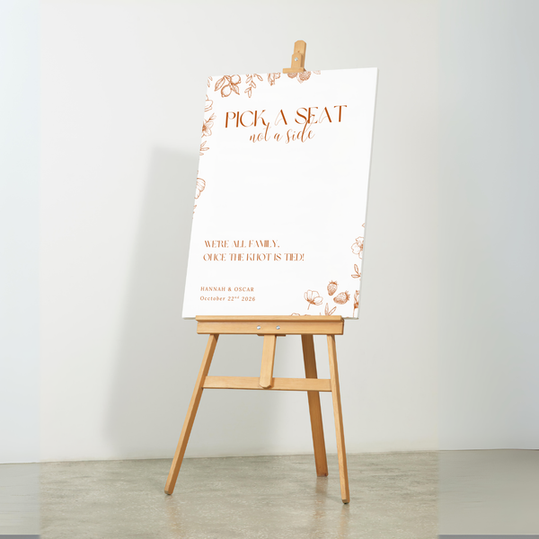 Sienna floral pick a seat not a side wedding sign with terracotta botanical sketches and elegant boho typography